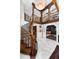 Elegant foyer with a wood staircase, marble flooring, and views to the living room at 7225 Box Canyon Rd, Sedalia, CO 80135