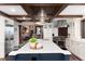 Spacious kitchen with a large island, custom cabinets, stainless steel appliances, and an open concept design at 7225 Box Canyon Rd, Sedalia, CO 80135