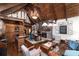 Spacious living room features a fireplace, a bar area, ample seating, and stylish decor at 7225 Box Canyon Rd, Sedalia, CO 80135