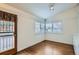 Bright bedroom featuring wood floors, natural light, and shuttered windows at 3356 Quivas St, Denver, CO 80211