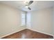 Bright bedroom with hardwood floors, neutral paint, and shuttered window at 3356 Quivas St, Denver, CO 80211
