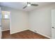 Empty bedroom with hardwood floors, neutral paint, and a ceiling fan at 3356 Quivas St, Denver, CO 80211