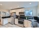 Updated kitchen features stainless steel appliances, modern fixtures, and ample countertop space at 3356 Quivas St, Denver, CO 80211