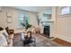 Cozy living room boasts a fireplace, mantel mirror, and neutral color scheme at 3356 Quivas St, Denver, CO 80211