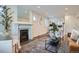 Stylish living room with a fireplace, modern decor, and an open floor plan at 3356 Quivas St, Denver, CO 80211