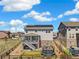 Two-story home featuring a fenced backyard, deck, hot tub, and solar panels at 24222 E Canyon Pl, Aurora, CO 80016
