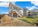 Spacious backyard with a hot tub on the patio and a trampoline on the lawn at 24222 E Canyon Pl, Aurora, CO 80016