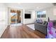Finished basement featuring a walkout to the backyard and a cozy seating area with built-in shelving at 24222 E Canyon Pl, Aurora, CO 80016