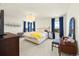 Spacious bedroom with ample natural light, carpet floors, and stylish furnishings at 24222 E Canyon Pl, Aurora, CO 80016
