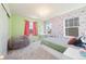 Bright bedroom with floral wallpaper and large windows, perfect for a relaxing retreat at 24222 E Canyon Pl, Aurora, CO 80016