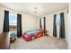 bedroom featuring carpet, large windows with black-out curtains and unique hot-wheels car bed at 24222 E Canyon Pl, Aurora, CO 80016