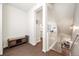 Entryway with hardwood floors, a bench, and view into the kitchen at 24222 E Canyon Pl, Aurora, CO 80016