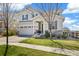 Charming two-story home boasts beautiful stone accents, a well-manicured lawn, and a two-car garage at 24222 E Canyon Pl, Aurora, CO 80016