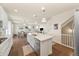 Bright living area with a modern kitchen featuring a center island at 24222 E Canyon Pl, Aurora, CO 80016