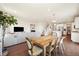 Open concept living and dining area with hardwood floors and modern furnishings at 24222 E Canyon Pl, Aurora, CO 80016