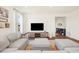 Comfortable living room features a large TV and a stylish, neutral color scheme at 24222 E Canyon Pl, Aurora, CO 80016
