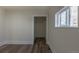 Light-filled bedroom with wood plank flooring and a closet at 1435 Jay St, Lakewood, CO 80214