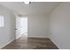 Bright bedroom featuring wood floors, a doorway leading to another room, and ample natural light at 1435 Jay St, Lakewood, CO 80214