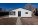 Exterior view of home showing a brick walkway and the house number above the front door at 1435 Jay St, Lakewood, CO 80214