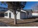 Charming home with a textured exterior, well-kept landscaping, and a brick walkway at 1435 Jay St, Lakewood, CO 80214