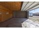 Attached garage with an exposed ceiling and access to yard at 1435 Jay St, Lakewood, CO 80214