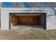 View of the garage interior, highlighting the unfinished walls and ceiling at 1435 Jay St, Lakewood, CO 80214