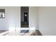 Bright hallway with wood floors leading to the kitchen, offering a view of the kitchen's interior at 1435 Jay St, Lakewood, CO 80214