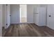 Open kitchen featuring a refrigerator, wood-look floors and white cabinets at 1435 Jay St, Lakewood, CO 80214