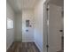 Convenient laundry room with wood plank floors, white shiplap ceiling and utility connections at 1435 Jay St, Lakewood, CO 80214