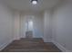 Spacious living room featuring wood-look floors and white walls at 1435 Jay St, Lakewood, CO 80214
