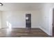 Large open living space with light gray walls and vinyl plank flooring at 1435 Jay St, Lakewood, CO 80214