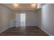 Well-lit room highlighting tray ceilings and wood-look flooring at 1435 Jay St, Lakewood, CO 80214