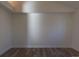 A clean room with wood floors, and neutral walls that give a minimalist look that would make a great office or bedroom at 1435 Jay St, Lakewood, CO 80214
