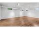 Large, open basement area with hardwood floors, white walls, and industrial lighting, ideal for customization at 685 N Emerson St, Denver, CO 80218