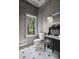 Stylish bathroom showcasing a patterned ceiling and floor, with a sleek vanity at 685 N Emerson St, Denver, CO 80218