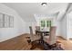 Bright dining area featuring hardwood floors, cowhide rug and charming window seat overlooking the backyard at 685 N Emerson St, Denver, CO 80218