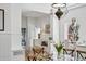 Bright dining room boasts a clear glass table and charming built-in bench seating at 685 N Emerson St, Denver, CO 80218