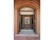 Inviting entryway showcasing a beautiful wood door and decorative mosaic tile flooring at 685 N Emerson St, Denver, CO 80218
