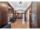 Spacious foyer featuring hardwood floors, wood paneling, and an open layout to living areas at 685 N Emerson St, Denver, CO 80218