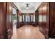 Elegant foyer with hardwood floors, wood paneling, and a decorative chandelier, creating a grand entrance at 685 N Emerson St, Denver, CO 80218