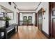 Spacious hallway featuring wood accents, hardwood floors, and a decorative mirror and table at 685 N Emerson St, Denver, CO 80218
