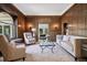 Cozy living room featuring wood paneling, comfortable seating, and stylish decor at 685 N Emerson St, Denver, CO 80218