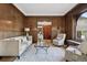 Comfortable living room with wood paneling, ample seating, and a bright atmosphere at 685 N Emerson St, Denver, CO 80218