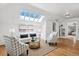 Bright living room with skylight, neutral furniture, and an open layout at 685 N Emerson St, Denver, CO 80218
