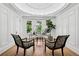 Bright office space with large windows, zebra print chairs, hardwood floors, and intricate ceiling details at 685 N Emerson St, Denver, CO 80218