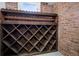 Charming brick wine cellar with rustic wooden shelves, perfect for storing your favorite vintages at 685 N Emerson St, Denver, CO 80218