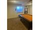 Entertainment room with a pool table, window with a view, and carpeted flooring at 2170 Granite Dr, Brighton, CO 80603