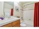 Bathroom features white tile, shower-tub combo, and ample lighting at 4061 Nordland Trl, Castle Rock, CO 80109