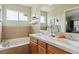 Bright bathroom features double sinks, white tile, and large tub at 4061 Nordland Trl, Castle Rock, CO 80109