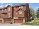 Exterior view of townhome with attached garages and stone accents at 4061 Nordland Trl, Castle Rock, CO 80109